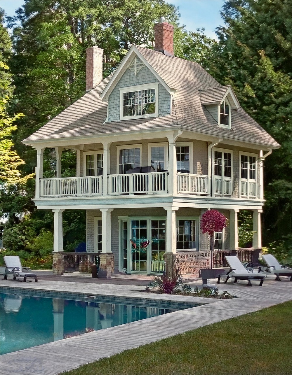 Cottage-Style Pool House with a Porch