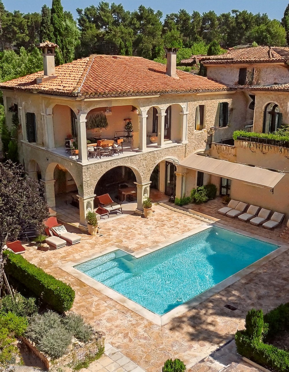 Mediterranean Pool House with a Terracotta Roof